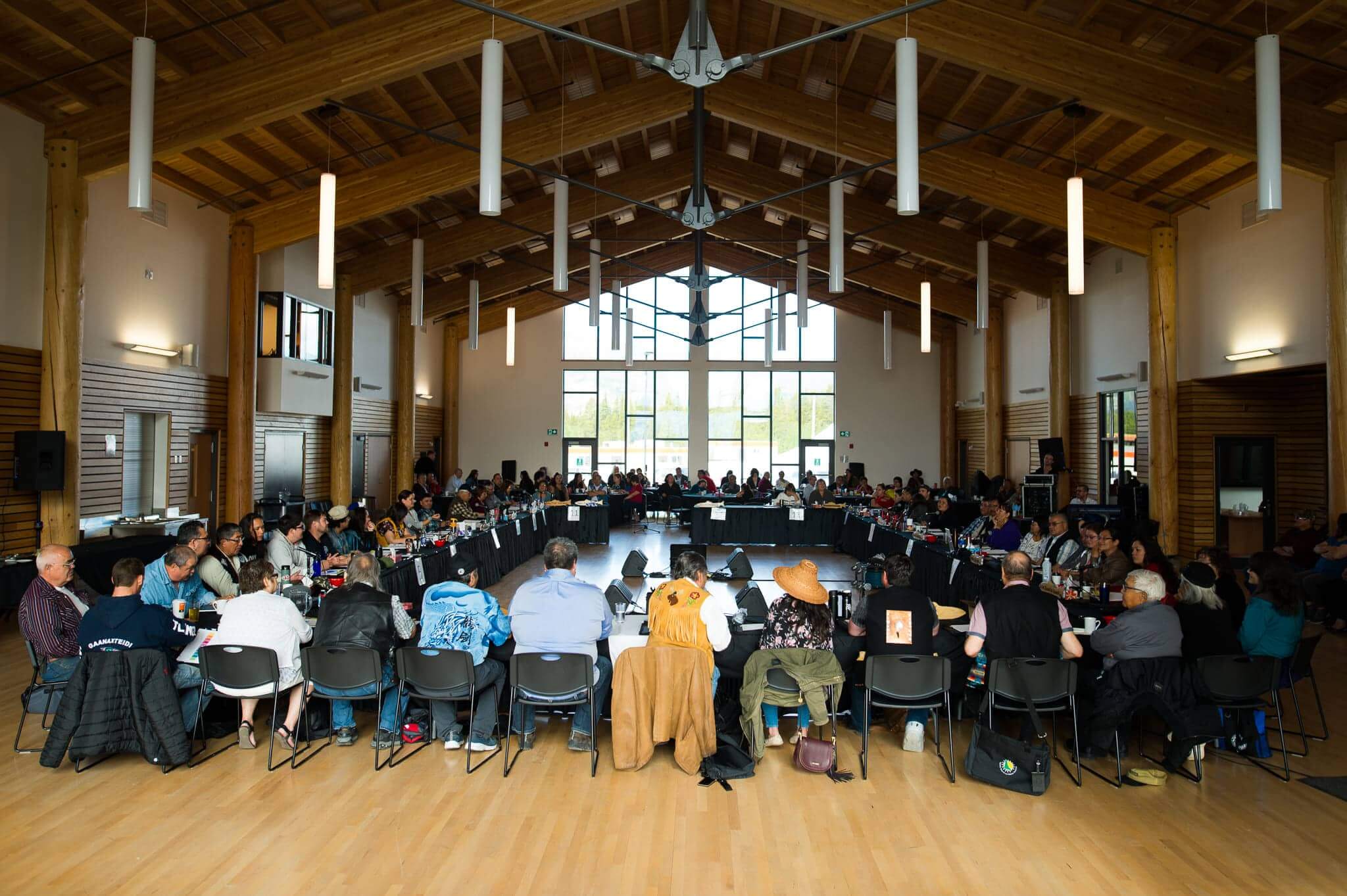 A square of chairs is in the Haa Shagóon Hídi Cultural Centre for the Council of Yukon First Nations General Assembly