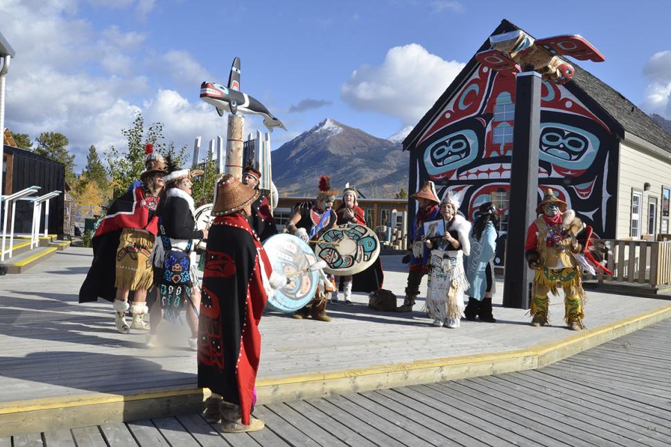 The Dakhká Khwáan inland Tlingit dance group perform traditional songs and dances in the Carcross Commons. The Commons is both a tourism destination and a gathering place for the community. (Photo: Government of Yukon)